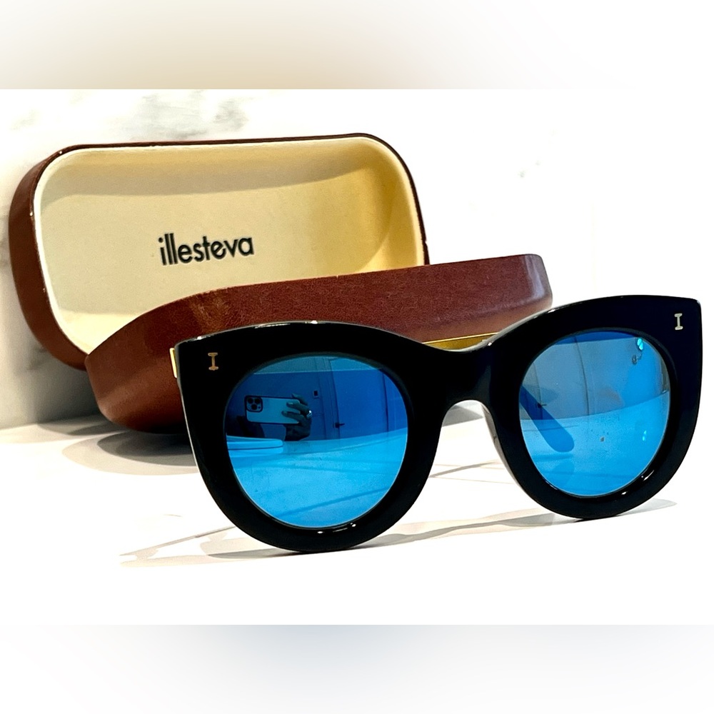 Illesteva Boca II black sunglasses with blue mirror.